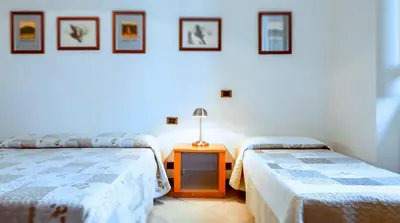 Letto o letti in una camera di Fiume & Zannoni Apartments by 360Rentals