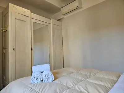 Letto o letti in una camera di [Ognissanti] Excelsior Apartment