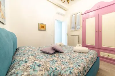 Letto o letti in una camera di Casa Lorenzo with a quiet tiny patio