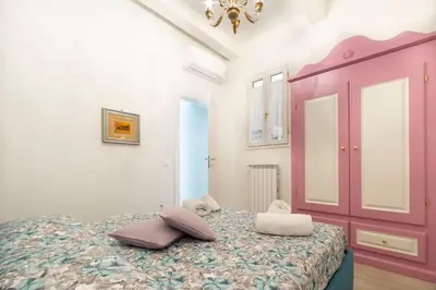Letto o letti in una camera di Casa Lorenzo with a quiet tiny patio