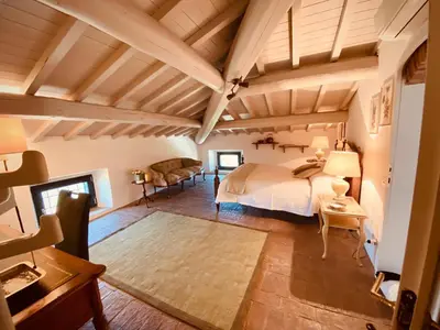Letto o letti in una camera di Mansarda Isabella