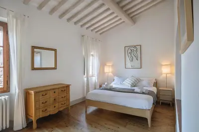 Letto o letti in una camera di Panoramic loft with terrace near Ponte Vecchio