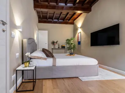 Letto o letti in una camera di Santa Croce Luxury Suite - Dolcevita Holiday