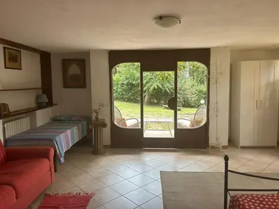 Letto o letti in una camera di Open Space nel Parco con parcheggio gratuito