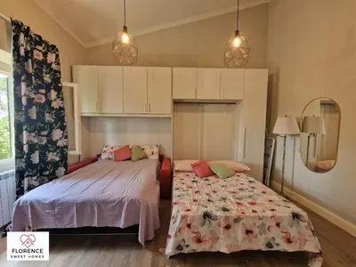 Letto o letti in una camera di Lella Apartment with free parking by Florence Sweet Homes