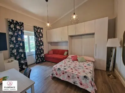 Letto o letti in una camera di Lella Apartment with free parking by Florence Sweet Homes