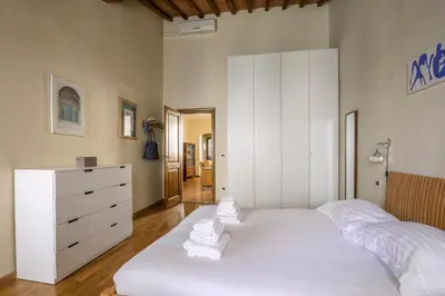 Letto o letti in una camera di Charming Apartment in Oltrarno