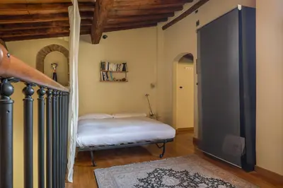 Letto o letti in una camera di Charming Apartment in Oltrarno