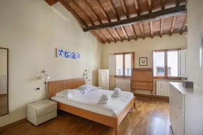 Letto o letti in una camera di Charming Apartment in Oltrarno