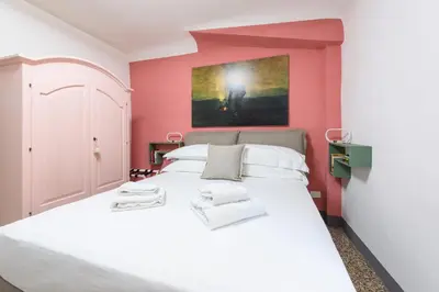 Letto o letti in una camera di Osteria del Guanto by Mmega