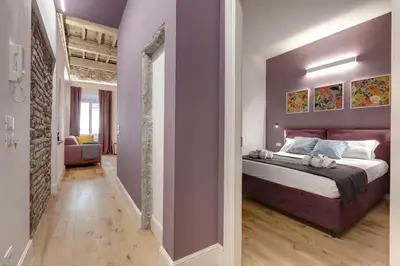 Letto o letti in una camera di Aperol & Spritz Apartments by Mamo Florence