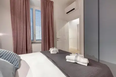 Letto o letti in una camera di Aperol & Spritz Apartments by Mamo Florence