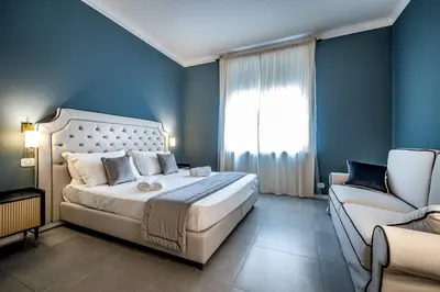Letto o letti in una camera di YID Lamarmora luxury contemporary apartment
