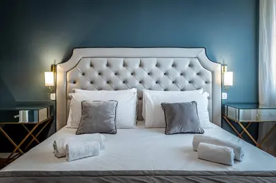 Letto o letti in una camera di YID Lamarmora luxury contemporary apartment