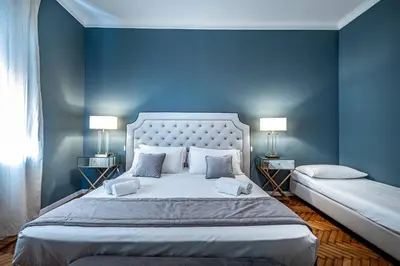 Letto o letti in una camera di YID Lamarmora luxury contemporary apartment