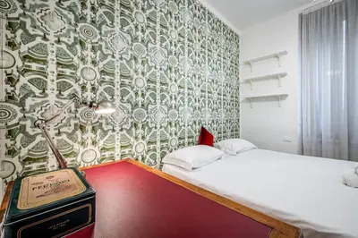 Letto o letti in una camera di YID LUX SUITE BOLOGNESE