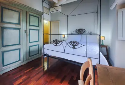 Letto o letti in una camera di Apartments Florence- Borgo Pinti with Frescoes