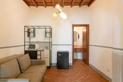 Area soggiorno di Stunning & Sunny Studio near Piazza Santo Spirito