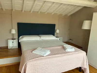 Letto o letti in una camera di Mansarda Salviatino