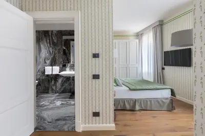 Letto o letti in una camera di Apartments Florence - Palazzo Signoria Luxury Apartments 10- Giuditta