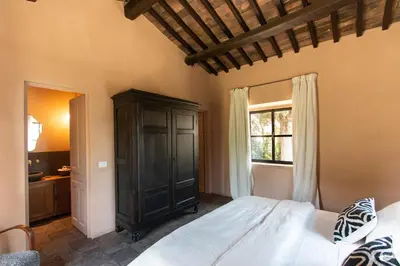 Letto o letti in una camera di Tenuta del Podestà villa di charme