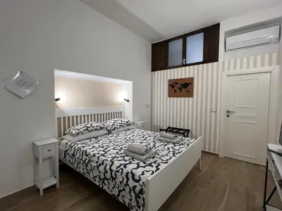 Letto o letti in una camera di AL 106 Apartment [Free Wi-fi 5 min dalla Stazione]