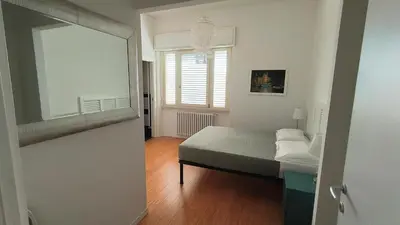 Letto o letti in una camera di Villa Le Statue