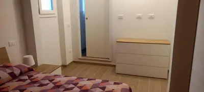 Letto o letti in una camera di appartamento 4/5 posti letto