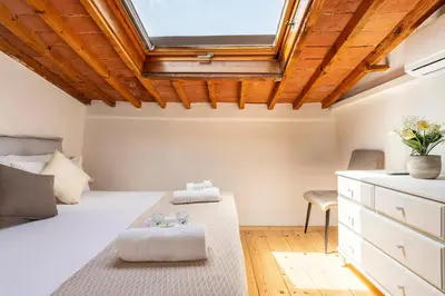 Letto o letti in una camera di [Piazza Santo Spirito] Appartamento con 2 Camere Matrimoniali