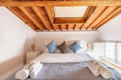 Letto o letti in una camera di [Piazza Santo Spirito] Appartamento con 2 Camere Matrimoniali