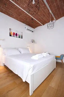 Letto o letti in una camera di The Chianti Rooster Flat