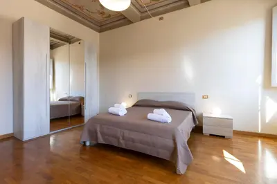 Letto o letti in una camera di Santo Spirito Huge Apartment