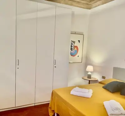 Letto o letti in una camera di Sweet Home Florence