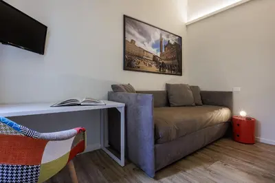 TV o dispositivi per l'intrattenimento presso Betty Florence charming modern apartment near Piazza della Libertà