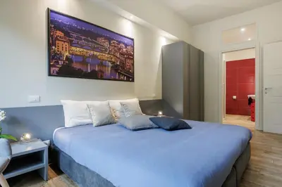Letto o letti in una camera di Betty Florence charming modern apartment near Piazza della Libertà