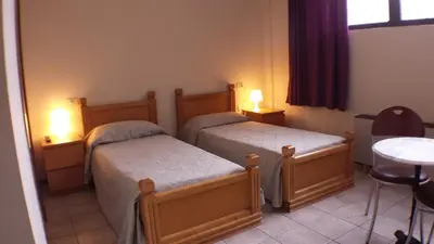 Letto o letti in una camera di Hotel Firenze 2000