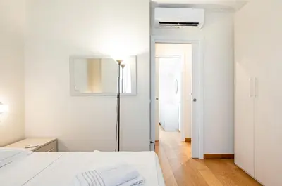 Letto o letti in una camera di GuestHost - La Corte del Re - Piazza della Libertà Apartment