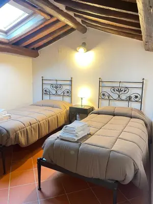 Letto o letti in una camera di Charming Self House