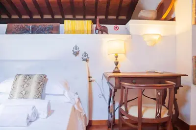 Letto o letti in una camera di Machiavelli Superior House
