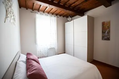 Letto o letti in una camera di YOUR APARTMENT IN FLORENCE