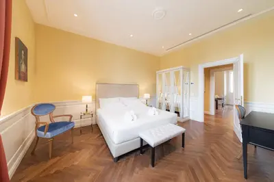 Letto o letti in una camera di Algilà Luxury Torrigiani Apartments