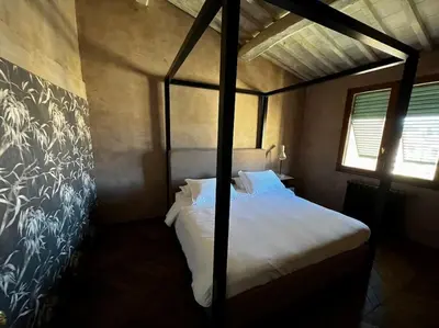 Letto o letti in una camera di Via delle Caldaie