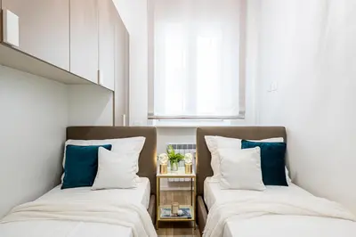 Letto o letti in una camera di Alessio Bros central luxury
