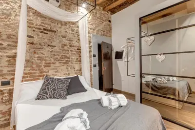 Letto o letti in una camera di Vigna Vecchia Studio by Mamo Florence