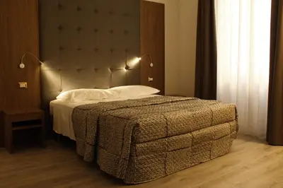Letto o letti in una camera di LunArt