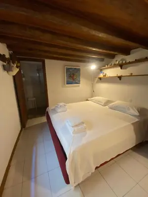 Letto o letti in una camera di Piccola stanza al Duomo
