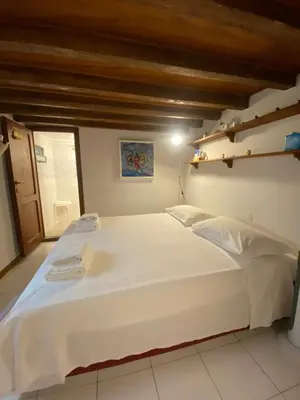 Letto o letti in una camera di Piccola stanza al Duomo