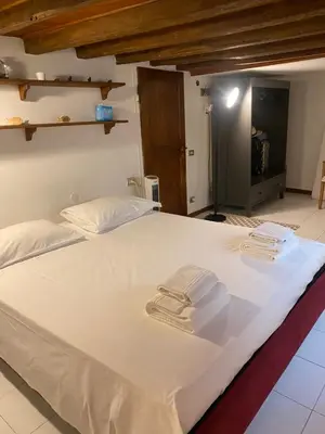 Letto o letti in una camera di Piccola stanza al Duomo