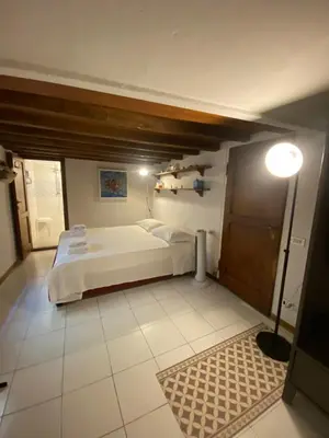 Letto o letti in una camera di Piccola stanza al Duomo