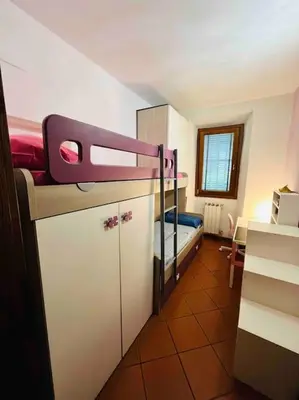 Letto o letti in una camera di Casa Maria